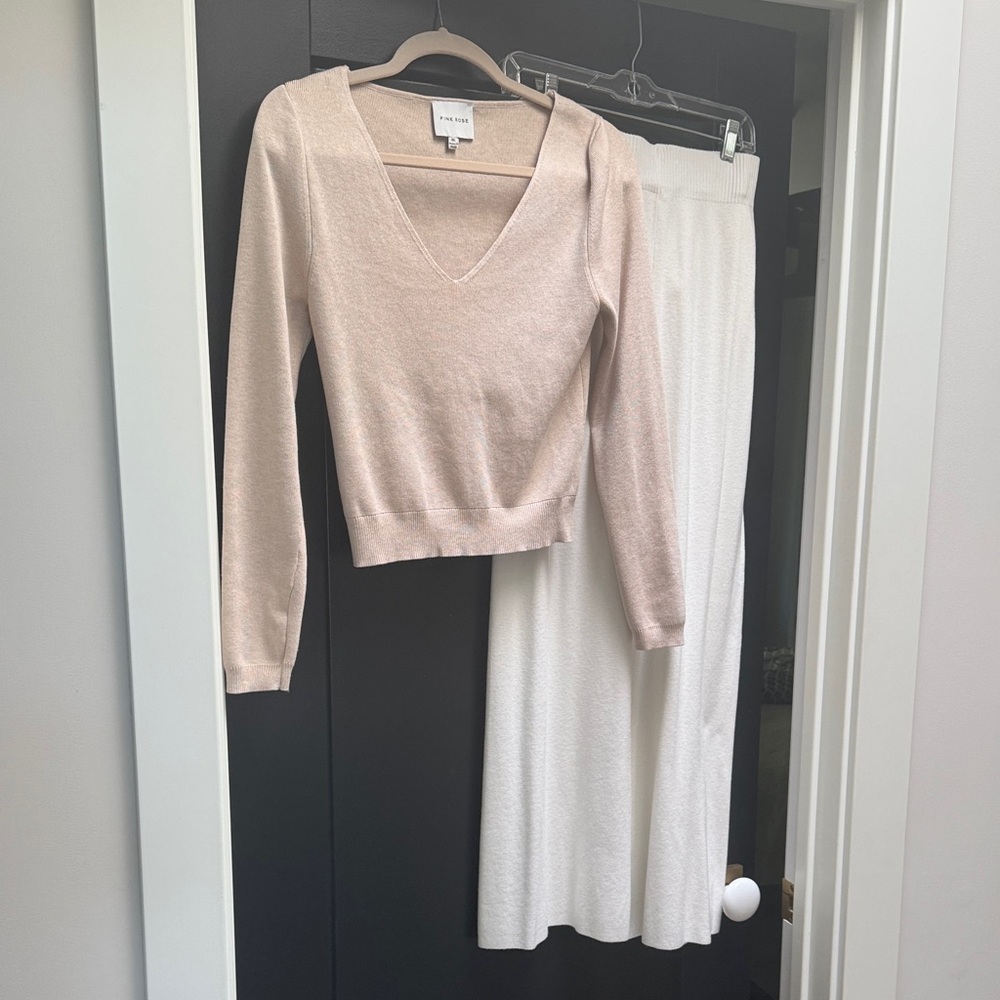 This is a two piece knit sweater outfit pants and top